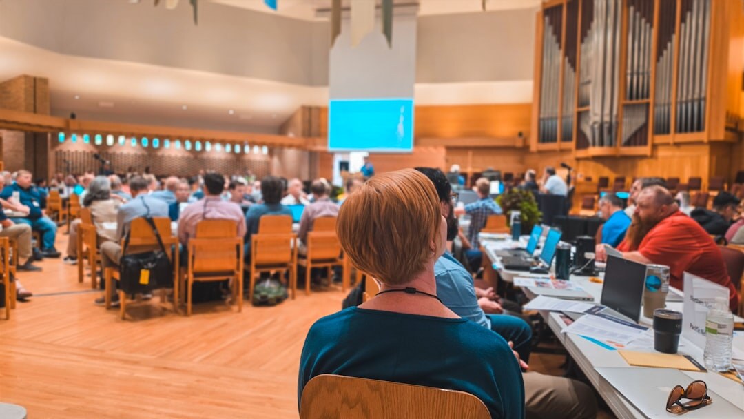 economists discussing at conference