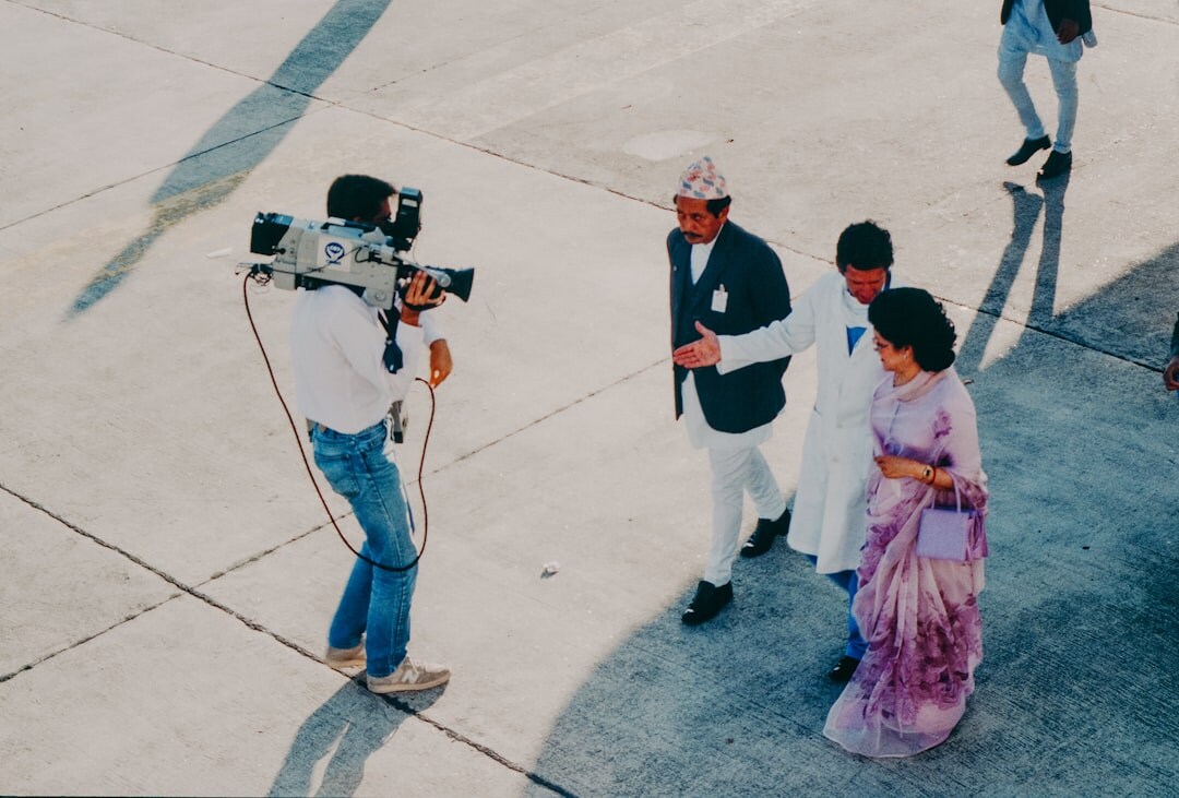 Red carpet event with photographers and flashing cameras